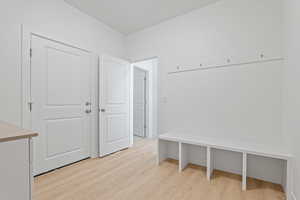 Mudroom featuring light wood finished floors