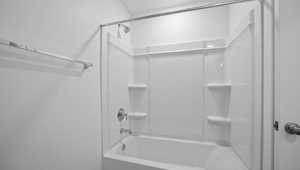 Full bathroom with shower / bathtub combination