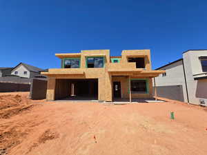 Unfinished property with stucco siding