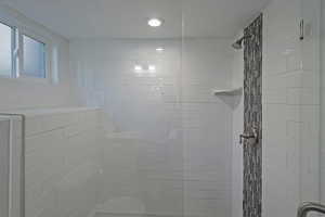 Bathroom with tiled shower