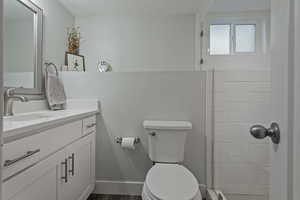 Bathroom with vanity and a tile shower
