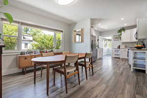 Dining room with recessed lighting and wood finished floors