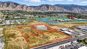 Aerial overview of property's location with property parcel outlined and mountains