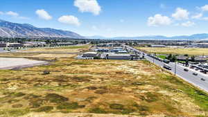 Aerial perspective of suburban area featuring a mountain backdrop