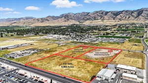 Aerial overview of property's location featuring property parcel outlined and mountains