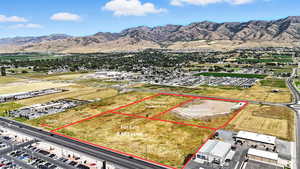 Aerial overview of property's location featuring a mountain backdrop and property boundaries highlighted