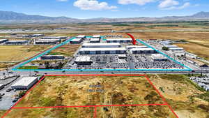 Aerial view of property's location featuring mountains and property parcel outlined