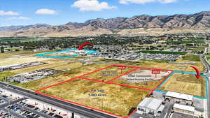 Aerial overview of property's location with property boundaries highlighted and mountains