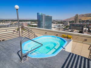 View of Common area Hot tub featuring a city view, and mountain view