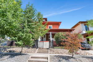 View of front of property with covered porch and brick siding