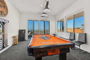 Rec room with carpet floors and pool table