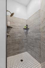 Full bathroom featuring tiled shower