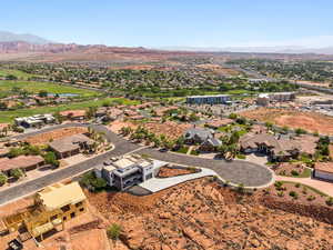 Aerial perspective of suburban area with a water and mountain view