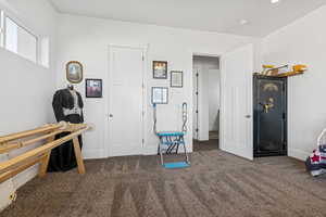 Game room with carpet floors and baseboards