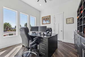 Office space with dark wood-type flooring, a ceiling fan, and recessed lighting