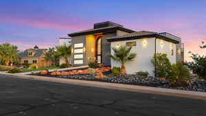 View of front of house with stucco siding