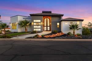View of front of house with stucco siding