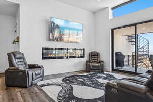 Living room featuring wood finished floors and baseboards