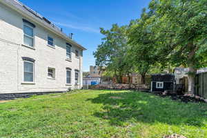 Fenced backyard with a storage shed