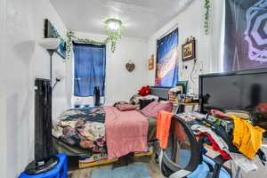 Bedroom with wood finished floors