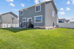 Rear view of house featuring stucco siding