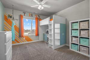 Unfurnished bedroom featuring carpet floors, a textured ceiling, and a ceiling fan