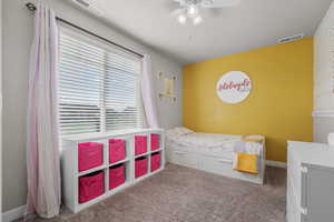 Bedroom with carpet and ceiling fan