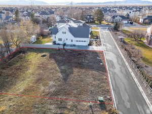 Aerial perspective of suburban area with property parcel outlined