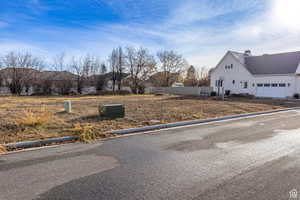 View of asphalt road with curbs