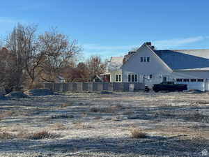 Back of property featuring a garage
