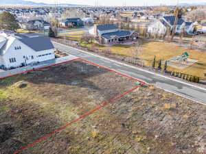 Aerial view of residential area featuring property boundaries highlighted