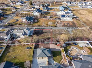 Aerial view of residential area featuring property boundaries highlighted