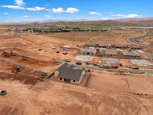 Aerial view of property's location with a mountainous background and rural landscape