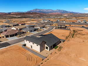 Aerial perspective of suburban area featuring a mountain backdrop