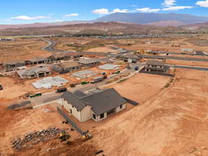 Aerial perspective of suburban area with a mountainous background and a desert landscape