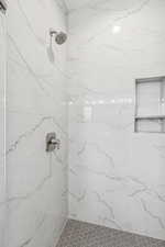 Full bath with tiled shower