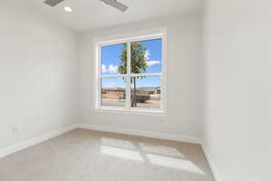 Unfurnished room featuring carpet flooring, recessed lighting, and a ceiling fan
