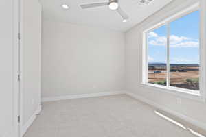 Spare room with light carpet, recessed lighting, and ceiling fan