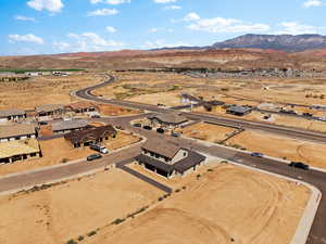 Overview of rural landscape with a mountainous background and nearby suburban area