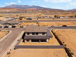 View of rural area with a mountain backdrop and a desert landscape