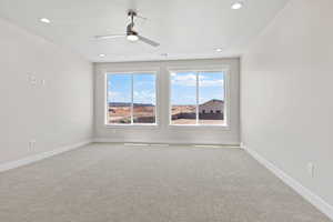 Carpeted spare room with ceiling fan, recessed lighting, and a textured ceiling