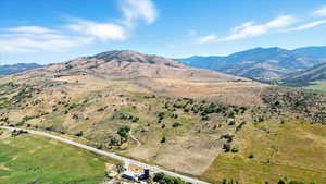 View of mountain background featuring rural landscape