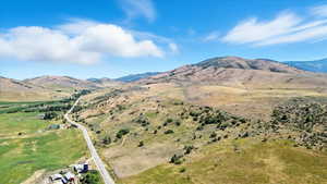 View of mountain backdrop with rural landscape