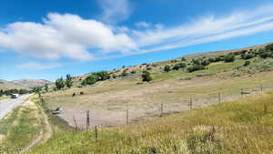 View of mountain backdrop with rural landscape