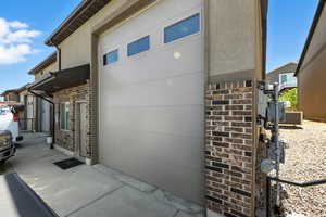 View of side of property with brick siding and stucco siding
