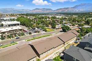 Aerial perspective of suburban area featuring a mountainous background