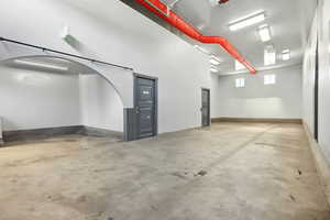 Garage featuring baseboards