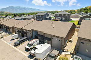Aerial perspective of suburban area featuring a mountainous background
