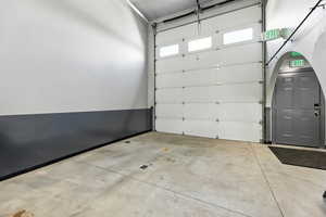 Garage featuring baseboards
