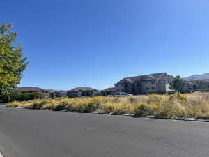 View of asphalt street with a residential view